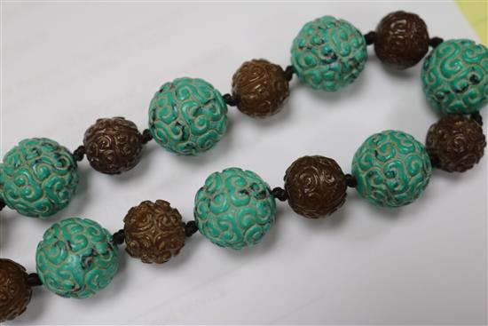 A carved turquoise and agate bead necklace.